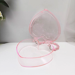 Rosa herzförmige Perlenhandtasche für Kinder mit transparentem Finish und Perlenriff