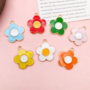 Colorful daisy flower metal keychains with gold borders and multi-color oil drips