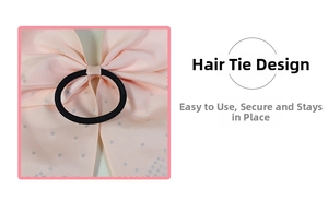Detail of pink polka dot ribbon bow with high elasticity black rubber hair tie