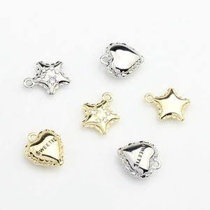 Golden and silver alloy star and heart pendants with Sweetie engraving and zircons