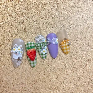 Embossed 3D nail art stickers with floral patterns and plaid designs in soft colors