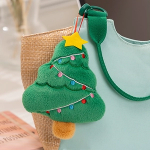Detail of green plush Christmas tree charm with embroidered bulbs on blue bag