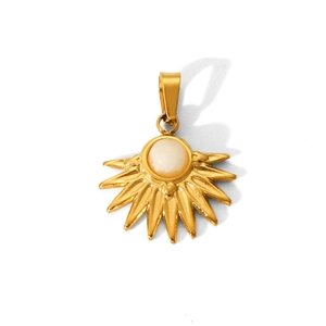 Detail of sun-shaped stainless steel pendant with white stone inlay on a white background