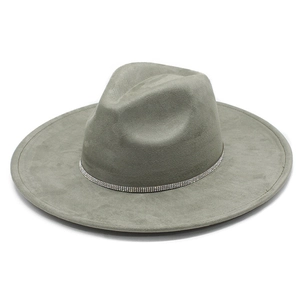 Macro detail of grey faux suede fedora featuring a sparkling silver rhinestone hatband