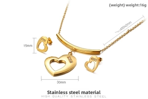 Detailed view of golden stainless steel heart jewelry set with necklace and earrings