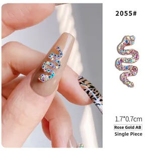 Detailed view of rose gold snake nail charm with colorful AB rhinestones and 1.7*0.7cm size