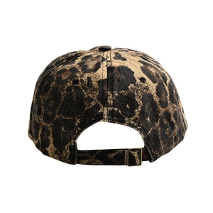 Detail view of the leopard print baseball cap back with adjustable metal buckle