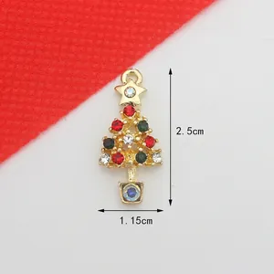 Detail of Christmas tree jewelry pendant with colorful rhinestones and gold alloy base