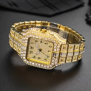 Luxurious gold square watch fully iced out with sparkling crystals and a calendar window