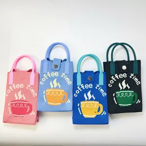 Detail of four colorful knitted mini tote bags with coffee time patterns and top handles