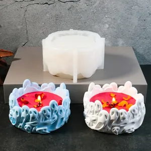 Detail of DIY silicone ghost group mold and finished candle on industrial grey pedestal