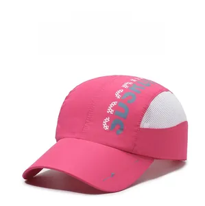 Close-up of pink quick-dry baseball cap with mesh panels and side letter printing