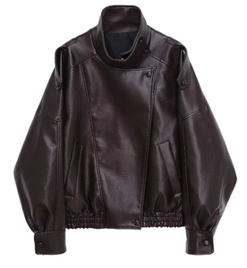 Detail of dark brown faux leather motorcycle jacket featuring washed texture and elastic hem