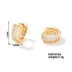 Detail view of C-shaped gold hoop earrings with clear cubic zirconia in 1.2cm size