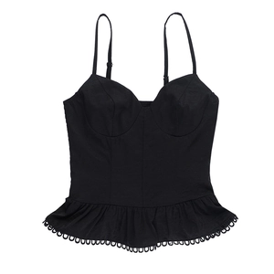 Detailed view of black slim-fit camisole top featuring ruffled hem and strap design