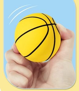 Detailed close-up showing the soft squeeze and high elasticity of the mini rubber basketball