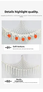 Detail of woven boho toy hammock with soft cotton tassels and decorative feathers