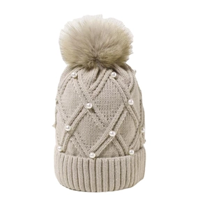 Women's warm winter knit hat in beige featuring diamond patterns and faux pearl accents