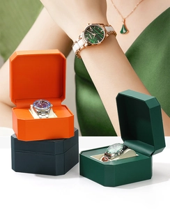 Luxurious octagonal PU leather watch boxes in orange, green, and blue with lady's ceramic watch