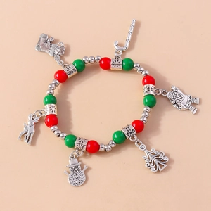 Detail of Christmas beaded bracelet with festive charms like Santa, tree and reindeer