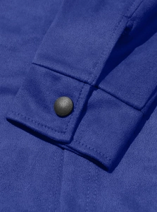 Detailed close-up of Royal blue suede fabric with a textured finish and matte black button