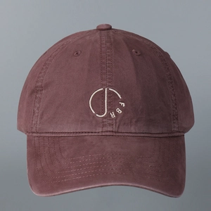 Close-up of FBR letter embroidery on burgundy cotton washed baseball cap crown