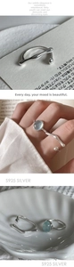 Detail of S925 silver ring with blue ice-cracked stone in a minimalist sleek style