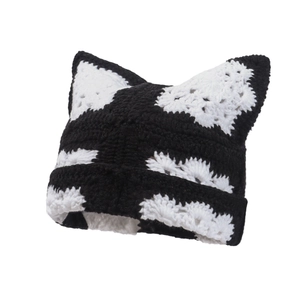 Handmade crochet cat ear beanie in black and white knit texture for cold weather