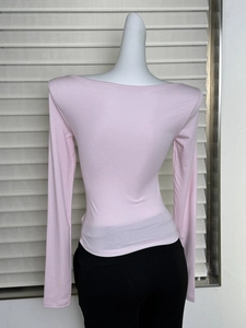 Detailed back view of pink long sleeve slim fit top with textured tencel fabric