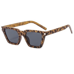 Elegant tortoiseshell frame sunglasses with dark lenses shown from a 45-degree angle