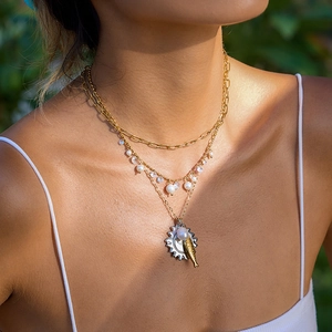 Layered 18K gold stainless steel necklace with pearls, rhinestones, and sun fish pendant
