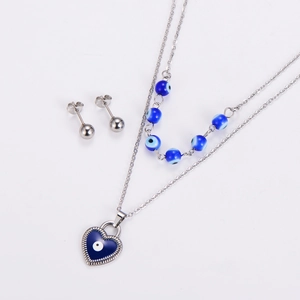 Detail of silver double-layered necklace and stud earrings set with blue evil eye heart