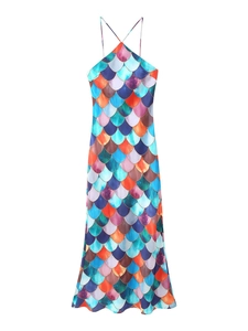 Detail shot of the colorful mermaid scale pattern on this slim fit halter maxi dress