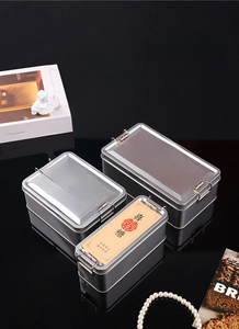 Close-up of three vintage rectangular tin boxes with metal buckles and wedding labels