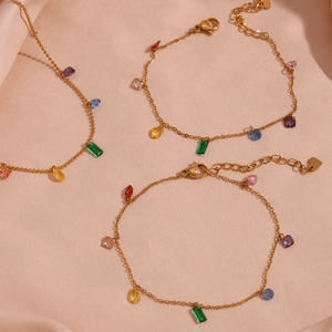 18K gold plated stainless steel bracelet with colorful zircon stones on pink silk cloth