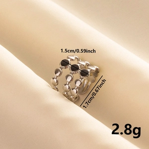Macro detail of triple-layer stainless steel ring with dimensions 1.7cm and 2.8g weight