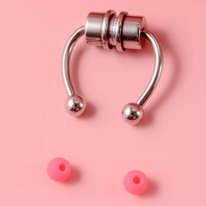 Macro shot of magnetic faux nose ring set with U-shaped clip and pink ball beads