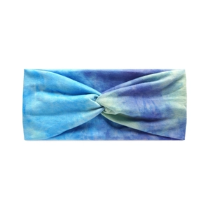 Detailed view of tie-dye knotted yoga headband in blue and purple soft elastic fabric