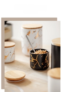 Detail of Nordic marble pattern ceramic jars with airtight bamboo lids for kitchen storage