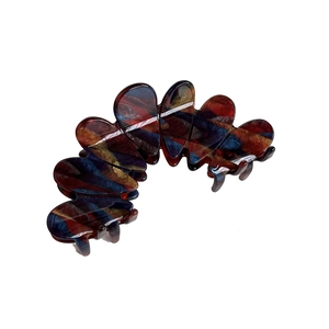 Large French acetate hair claw clip with colorful marble pattern and polished finish