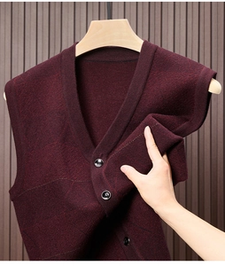 Detailed close-up of wine red knit vest showing high elasticity and soft texture