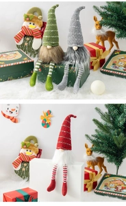 Close-up of three festive Christmas gnomes with striped legs on a holiday backdrop