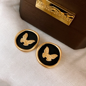 French vintage gold round stud earrings featuring a delicate black butterfly motif