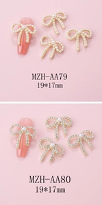 Detail of alloy bow nail art charms with pearls and rhinestones in 19x17mm size