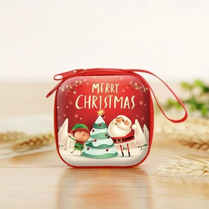 Red Christmas square coin purse with zipper and Merry Christmas print on wooden surface