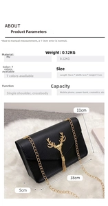 Detail view of black PU leather crossbody bag with golden deer head and tassel accent