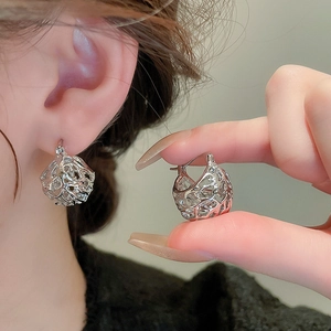 Silver hollow liquid metal drop earrings featuring an artistic vintage french design