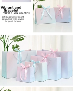 Close-up of marble pattern gift bags in gradient colors with silk bow and rope handles