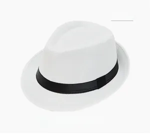 Close-up of a white woven straw sun hat with a classic black ribbon decorative band