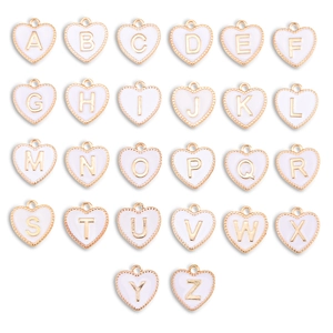 Set of 26 heart-shaped alphabet pendants with white enamel and golden beaded edges